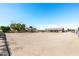 Horse property with shelters, outdoor space, and clear blue skies, ideal for equestrian activities at 18637 E Flintlock Dr, Queen Creek, AZ 85142