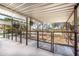 Horse stalls under shelter with secure metal fencing, offering comfort and security for animals at 18637 E Flintlock Dr, Queen Creek, AZ 85142