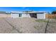 Backyard with low maintenance yard featuring a covered patio area, and block fencing at 2027 W Monte Vista Rd, Phoenix, AZ 85009