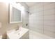 Bathroom featuring a white shower with tile surround, a sink and new fixtures at 2027 W Monte Vista Rd, Phoenix, AZ 85009
