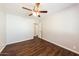Bright bedroom featuring wood-look flooring, and a ceiling fan for added comfort at 2027 W Monte Vista Rd, Phoenix, AZ 85009