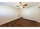 Comfortable bedroom with ceiling fan, wood floors and ample natural light at 2027 W Monte Vista Rd, Phoenix, AZ 85009