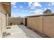 Enclosed backyard featuring a concrete patio and block wall, offering privacy at 2104 W Yukon Dr, Phoenix, AZ 85027