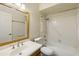 Well-lit bathroom featuring a shower-tub combo and vanity sink at 2104 W Yukon Dr, Phoenix, AZ 85027