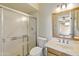 Functional bathroom with walk-in shower, white tiled walls, and a vanity sink at 2104 W Yukon Dr, Phoenix, AZ 85027
