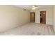 Expansive living room with neutral carpet and ceiling fan offering access to other rooms in the home at 2104 W Yukon Dr, Phoenix, AZ 85027