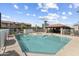 Community pool with a lounging area and well-maintained surroundings at 2104 W Yukon Dr, Phoenix, AZ 85027