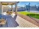 Back patio featuring a table, chairs and a BBQ grill at 21407 W Hubbell St, Buckeye, AZ 85396
