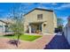 Backyard features a covered patio, synthetic grass lawn and desert landscaping at 21407 W Hubbell St, Buckeye, AZ 85396