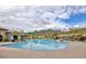 Sienna Hills Community Pool with mountain views, lounge chairs, splash pad and inviting blue water under partly cloudy skies at 21407 W Hubbell St, Buckeye, AZ 85396