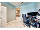 Comfortable office space with modern desk, rolling chair, and neutral walls at 21407 W Hubbell St, Buckeye, AZ 85396