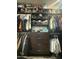 The walk-in closet has custom shelving with organizational bins and plenty of space for hanging clothes at 21407 W Hubbell St, Buckeye, AZ 85396