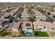 A high-angle aerial view of the home and property highlighting a private backyard pool and solar panels at 21857 N Gibson Dr, Maricopa, AZ 85139