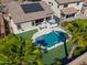 Aerial view showcasing the backyard pool, landscaping, patio, outdoor seating, and relaxing hot tub at 21857 N Gibson Dr, Maricopa, AZ 85139