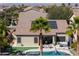 Backyard view showcasing pool, spa, patio, and solar panels for enhanced outdoor living at 21857 N Gibson Dr, Maricopa, AZ 85139