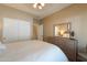 Bedroom boasting a large closet, sliding doors, and a dresser with a mirror at 21857 N Gibson Dr, Maricopa, AZ 85139