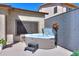 Outdoor hot tub with privacy screen, perfect for relaxation and enjoying the backyard ambiance at 21857 N Gibson Dr, Maricopa, AZ 85139