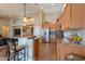 Well-equipped kitchen with stainless steel appliances, a center island with seating, and ample cabinetry for storage at 21857 N Gibson Dr, Maricopa, AZ 85139