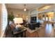 Inviting living room featuring vaulted ceilings, modern lighting, and comfortable leather seating creating a warm and welcoming space at 21857 N Gibson Dr, Maricopa, AZ 85139