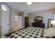 Spacious main bedroom featuring a checked bedspread and dark wood furnishings at 21857 N Gibson Dr, Maricopa, AZ 85139