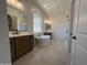 Elegant bathroom featuring double vanities, a soaking tub, and a glass enclosed shower at 22961 E Twin Acres Dr, Queen Creek, AZ 85142