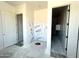 Modern bathroom featuring an open shower area and white doors at 22961 E Twin Acres Dr, Queen Creek, AZ 85142