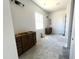 Bathroom featuring brown vanities, a window, and modern design elements at 22961 E Twin Acres Dr, Queen Creek, AZ 85142