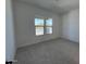 Clean bedroom with plush carpet, bright windows, and neutral colors at 22961 E Twin Acres Dr, Queen Creek, AZ 85142
