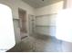 Unfinished walk-in closet featuring shelving and ample storage space at 22961 E Twin Acres Dr, Queen Creek, AZ 85142