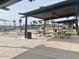 Shaded picnic tables and open spaces within a well-maintained community area at 22961 E Twin Acres Dr, Queen Creek, AZ 85142
