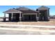 New construction home featuring neutral tones and a spacious three-car garage, awaiting your personal touches at 22961 E Twin Acres Dr, Queen Creek, AZ 85142