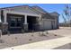 Beautiful home showcasing a covered front porch, well-kept landscaping, and a two-car garage at 22961 E Twin Acres Dr, Queen Creek, AZ 85142