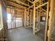 Wood framing showing electrical and plumbing connections, concrete floors, and views to other rooms at 22961 E Twin Acres Dr, Queen Creek, AZ 85142