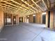 Wood framing reveals construction with concrete flooring and window openings at 22961 E Twin Acres Dr, Queen Creek, AZ 85142