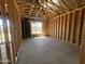 Bright unfinished room featuring wood framing and natural light through a window at 22961 E Twin Acres Dr, Queen Creek, AZ 85142