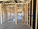 Unfinished room featuring wood framing, exposed utilities, and an open concept at 22961 E Twin Acres Dr, Queen Creek, AZ 85142