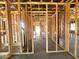 Exposed wood framing reveals construction with a concrete floor and rough-in plumbing at 22961 E Twin Acres Dr, Queen Creek, AZ 85142
