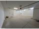 Spacious garage with ample room for parking and storage and door to the house at 22961 E Twin Acres Dr, Queen Creek, AZ 85142