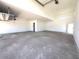 Spacious unfinished garage with high ceilings, offering abundant parking and storage at 22961 E Twin Acres Dr, Queen Creek, AZ 85142