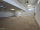 Spacious garage with ample room for parking and storage and door to the house at 22961 E Twin Acres Dr, Queen Creek, AZ 85142