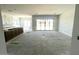 Spacious great room features ample natural light from large windows and sliding glass door at 22961 E Twin Acres Dr, Queen Creek, AZ 85142