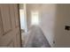 Bright hallway leading to various rooms with fresh, neutral paint and potential for customization at 22961 E Twin Acres Dr, Queen Creek, AZ 85142