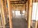 Unfinished interior framing reveals exposed studs, wiring, and other structural details in the new construction at 22961 E Twin Acres Dr, Queen Creek, AZ 85142