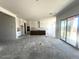 Spacious kitchen with large island, white cabinets and sliding glass doors providing abundant natural light at 22961 E Twin Acres Dr, Queen Creek, AZ 85142
