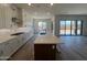 Open concept living area features a kitchen island with a sink and breakfast bar at 22961 E Twin Acres Dr, Queen Creek, AZ 85142