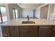 Bright kitchen featuring stainless steel appliances, ample counter space and seamless flow to the living area at 22961 E Twin Acres Dr, Queen Creek, AZ 85142