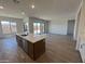 Gourmet kitchen featuring a large island with seating and a stainless steel dishwasher at 22961 E Twin Acres Dr, Queen Creek, AZ 85142