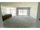 Open-concept living space featuring an abundance of natural light and modern slider doors to the exterior at 22961 E Twin Acres Dr, Queen Creek, AZ 85142