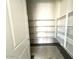 Walk-in pantry with custom shelving providing ample storage at 22961 E Twin Acres Dr, Queen Creek, AZ 85142