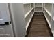 New construction pantry featuring wood look tile floors and open shelving for optimal storage solutions at 22961 E Twin Acres Dr, Queen Creek, AZ 85142